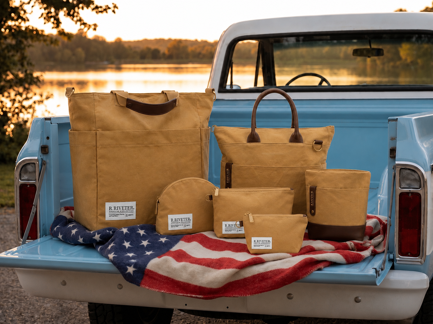 Assorted tan bags displayed on a pickup truck bed with a sunset backdrop