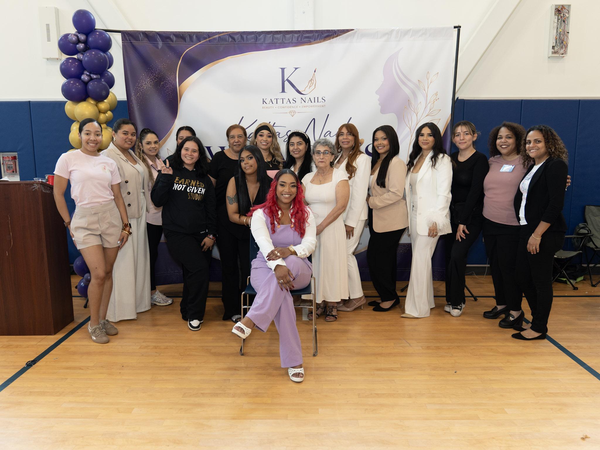 Group photo of women posing together at a Kattas Nails event.