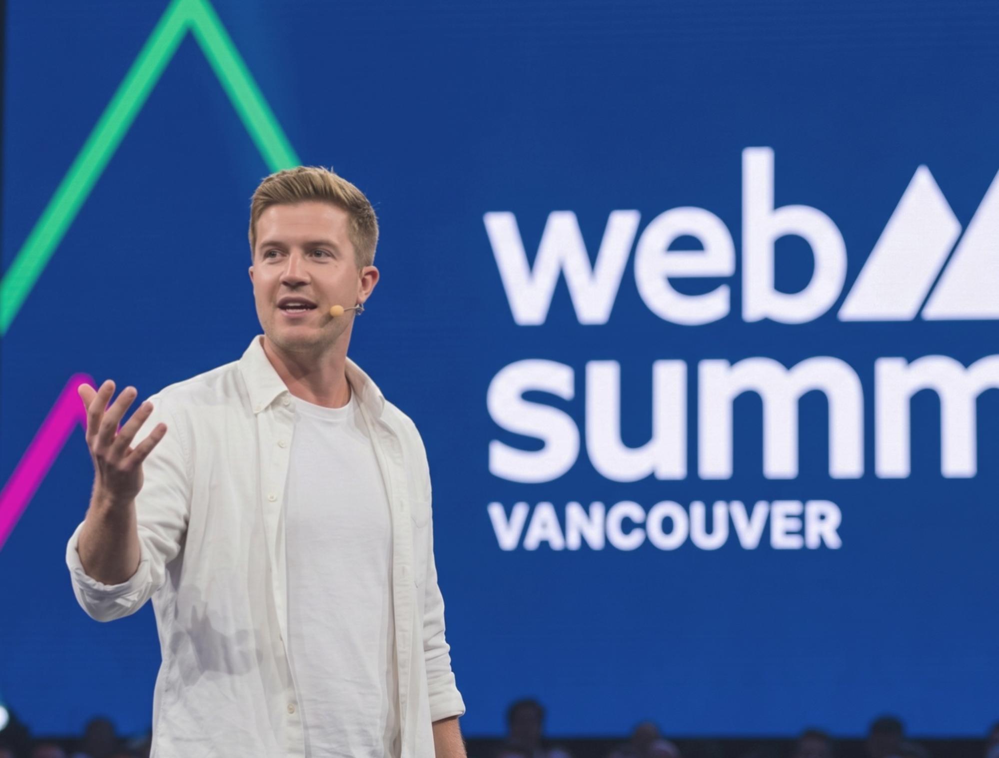 A speaker presents on stage at the Web Summit event in Vancouver