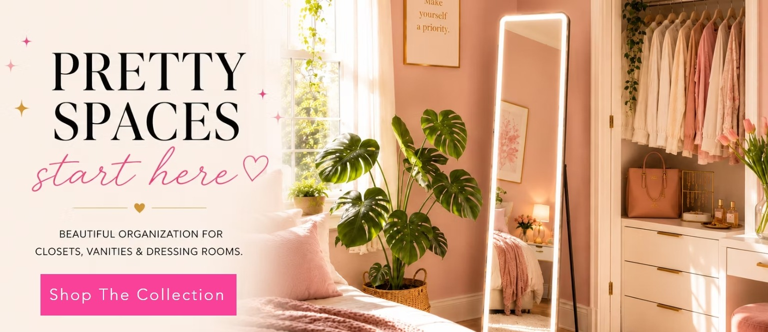 Bright, organized room with a dressing mirror, plants, and pink decor elements