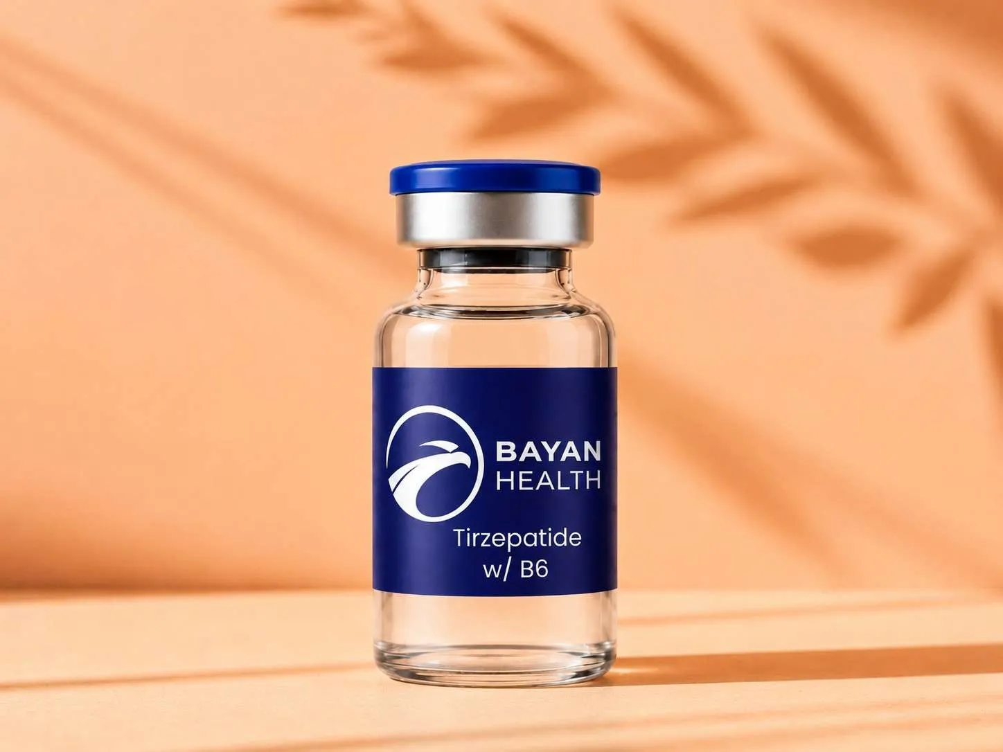A clear vial of Tirzepatide with B6 featuring a blue label and logo