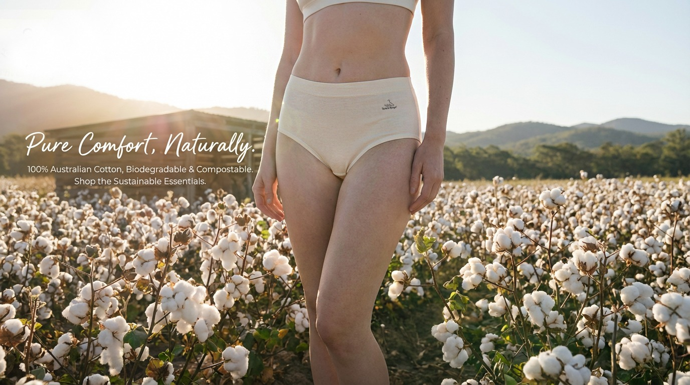 A person stands in a cotton field wearing sustainable underwear made from Australian cotton