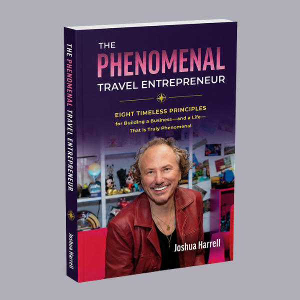 Book cover featuring a smiling man with curly hair, titled "The Phenomenal Travel Entrepreneur"