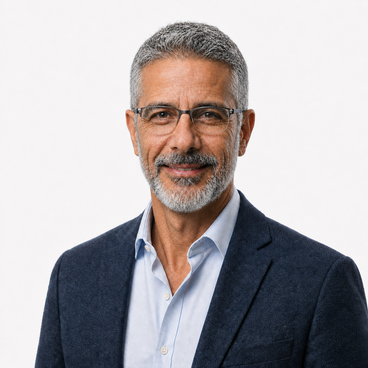 Smiling man with glasses, gray beard, wearing a blue blazer and light shirt