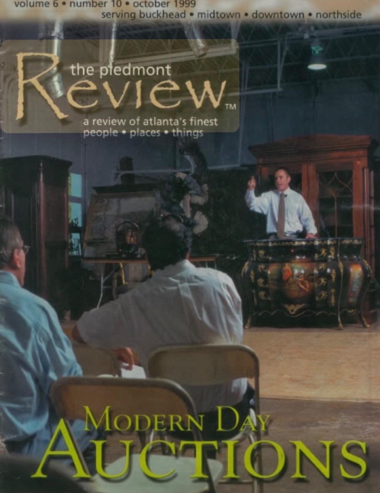 Auction scene with a male auctioneer and audience in a spacious room