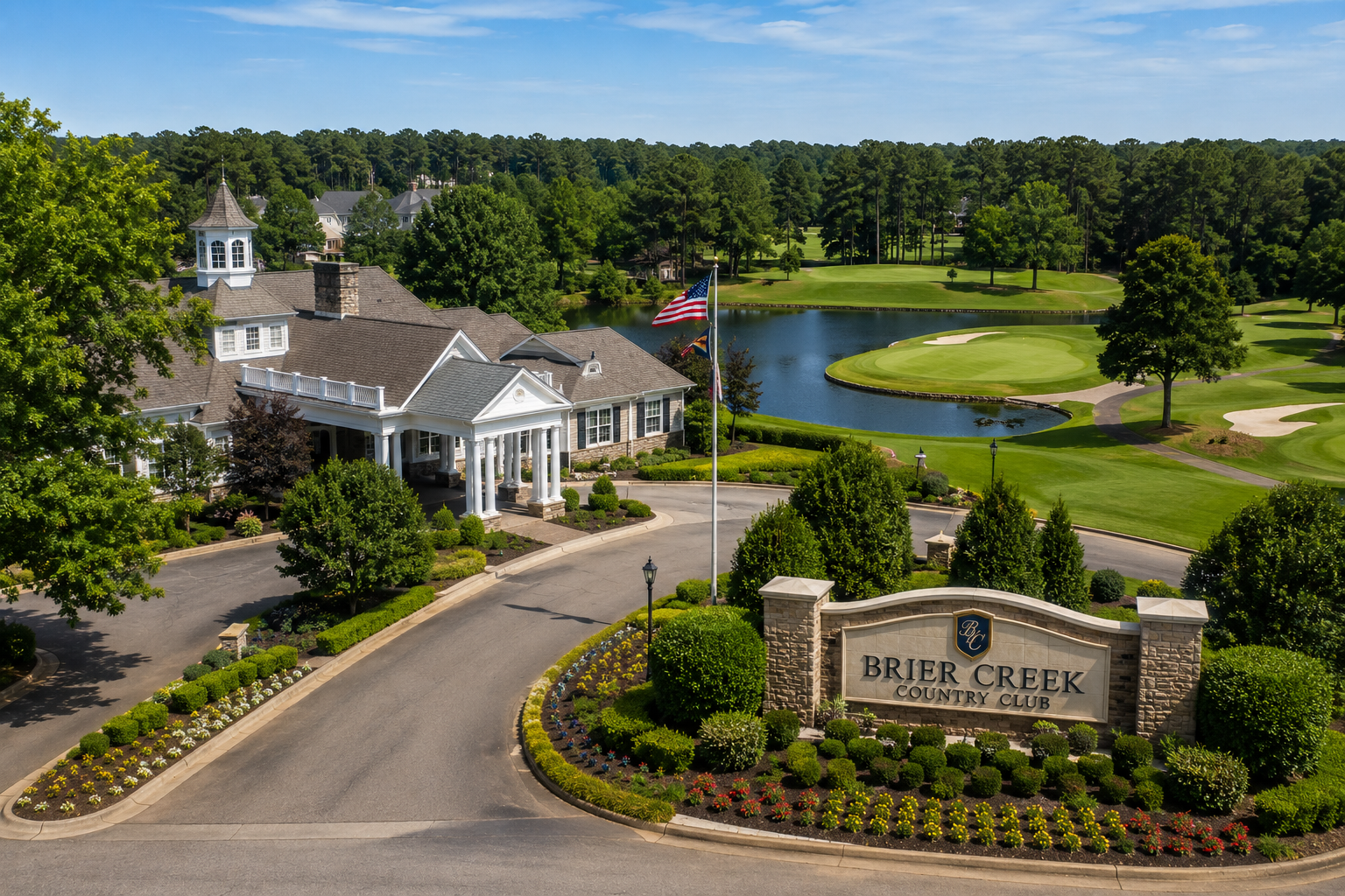 Aerial view of Brier Creek Country Club entrance with landscaping and golf course.