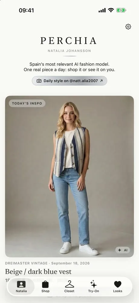 A woman models a beige and dark blue vest with casual jeans.
