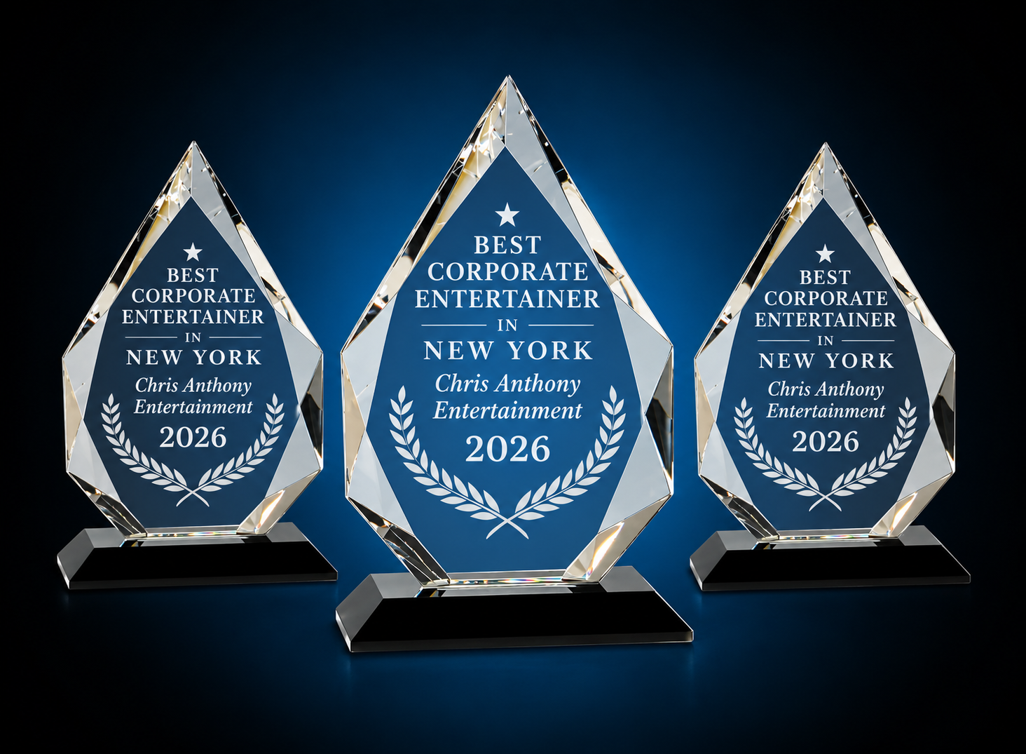 Three crystal awards displaying "Best Corporate Entertainer in New York 2026"
