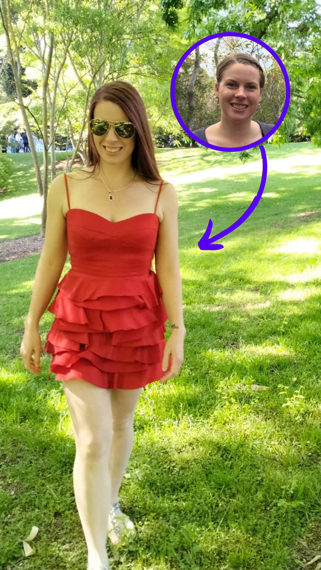 Woman in a red ruffled dress walking in a grassy park under sunlight