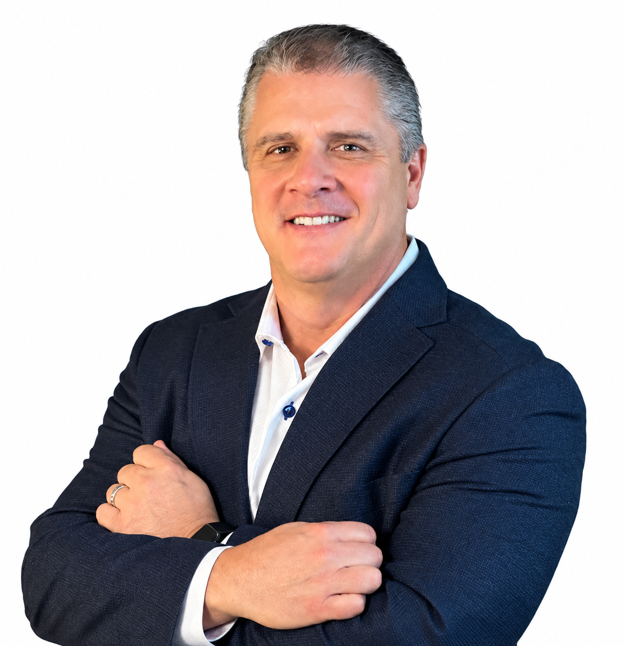 Smiling man in a blue blazer with arms crossed against a white background