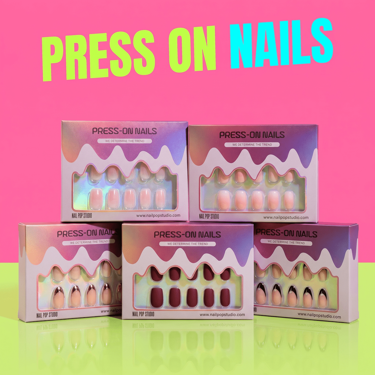 Collection of colorful press-on nails in stylish packaging on a vibrant background