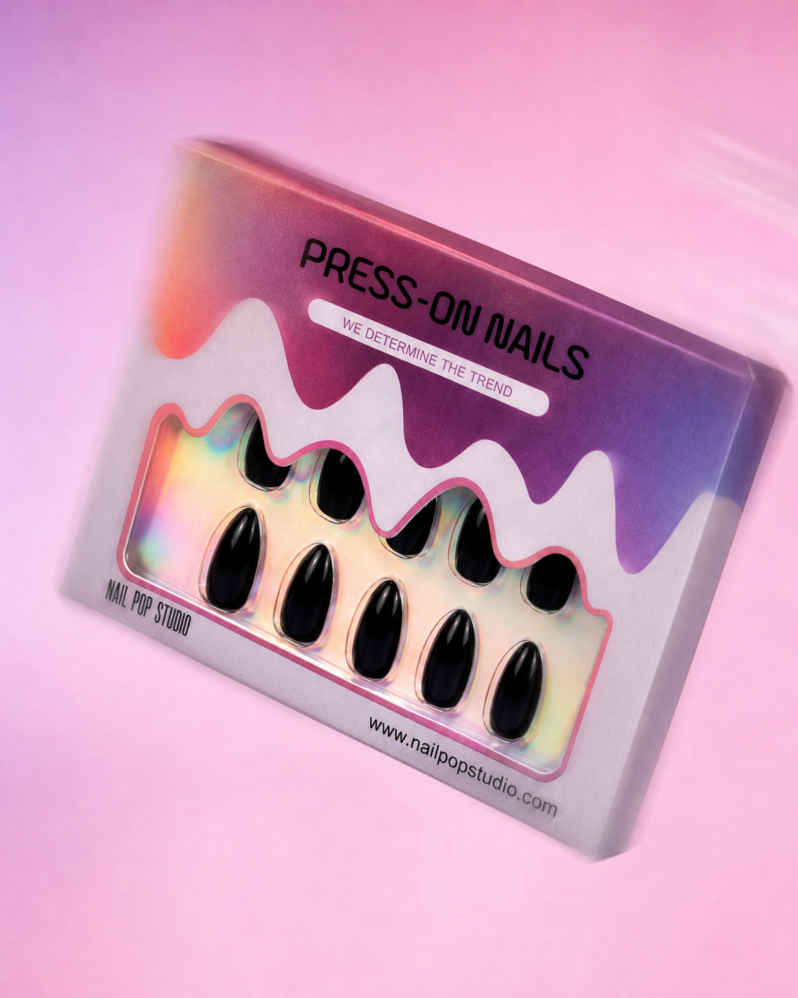 Box of black press-on nails with a colorful, abstract design on the packaging