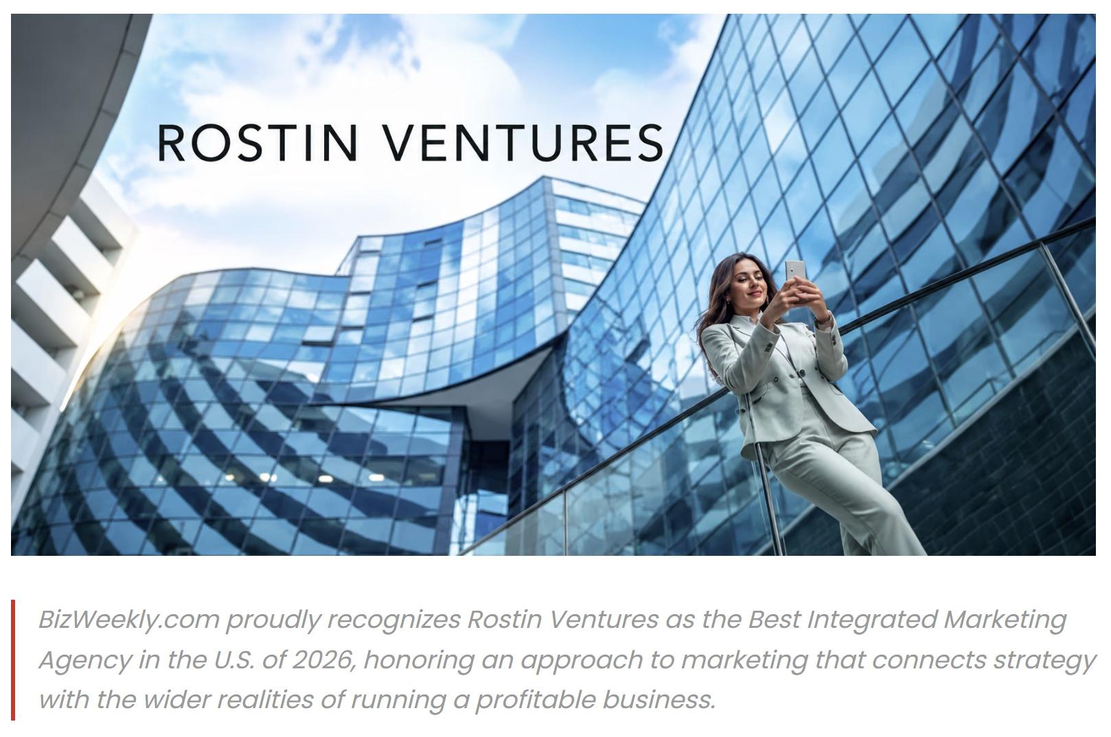 Businesswoman using a smartphone outside a modern glass building for Rostin Ventures recognition