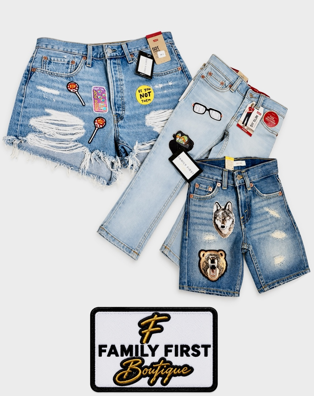 Three pairs of distressed denim shorts with colorful patches and a boutique logo