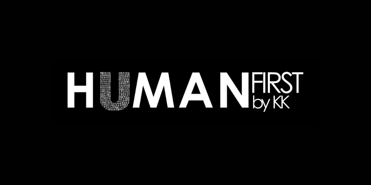 Text graphic displaying "HUMAN FIRST by KK" on a black background