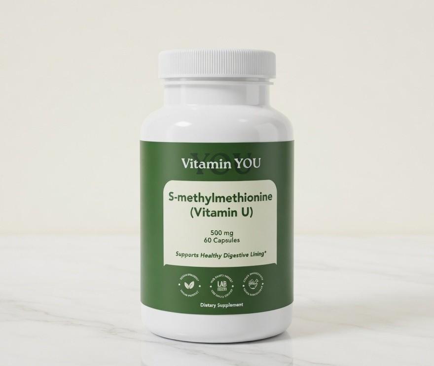White bottle labeled S-methylmethionine dietary supplement with green and white design on marble background
