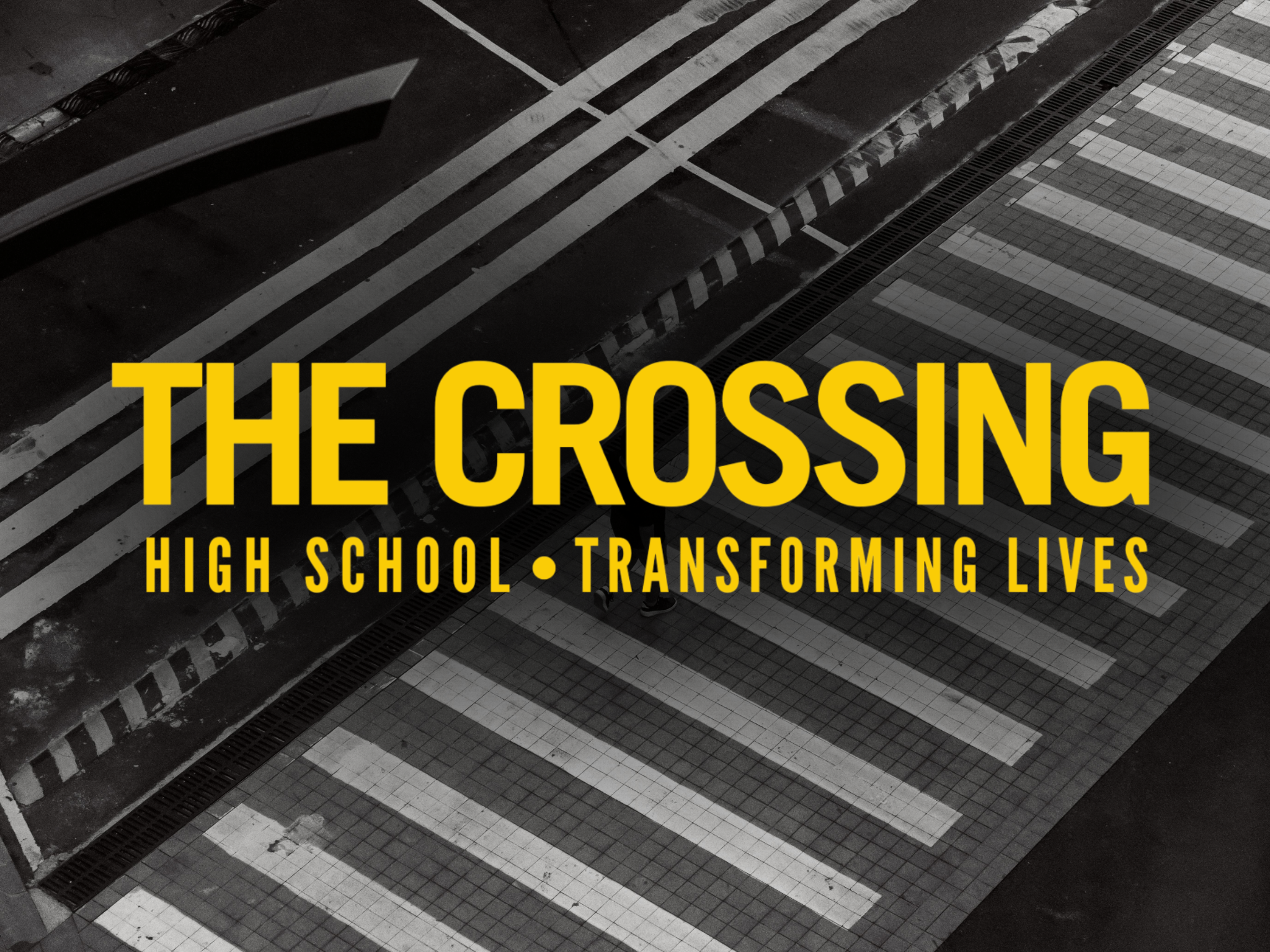 High school logo with bold text on a black and white crosswalk background