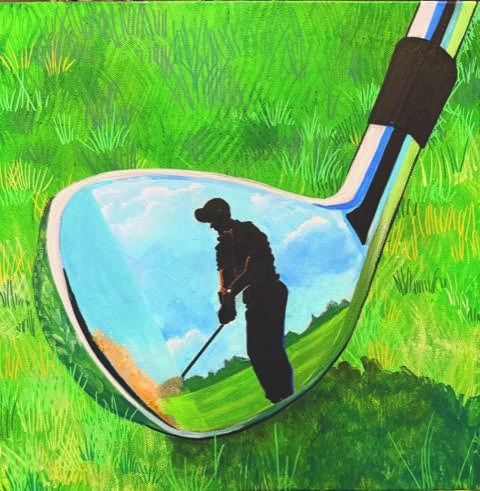 Reflection of a golfer in the shiny surface of a club on grass