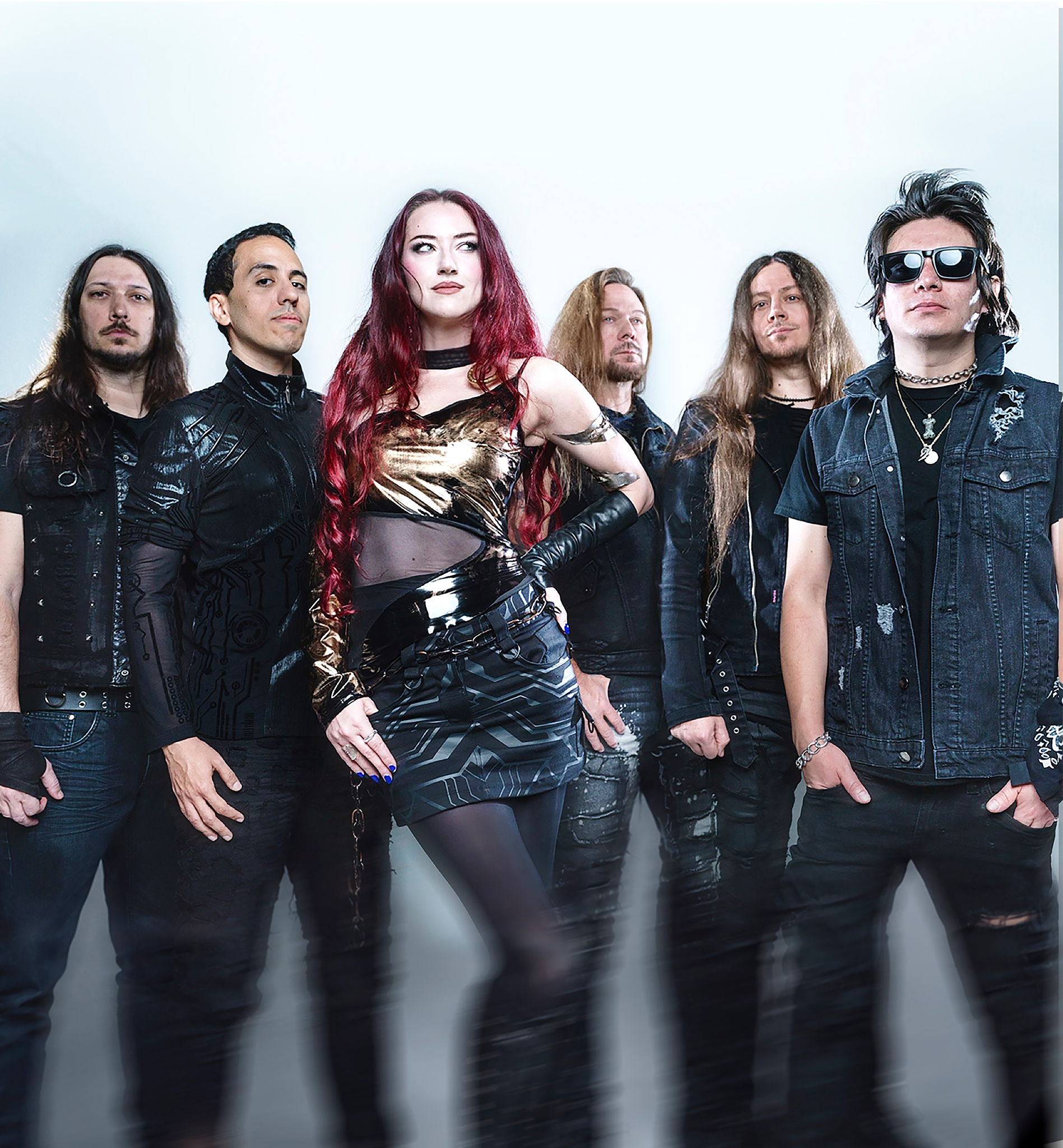 A six-member band poses together, showcasing a mix of edgy fashion and styles