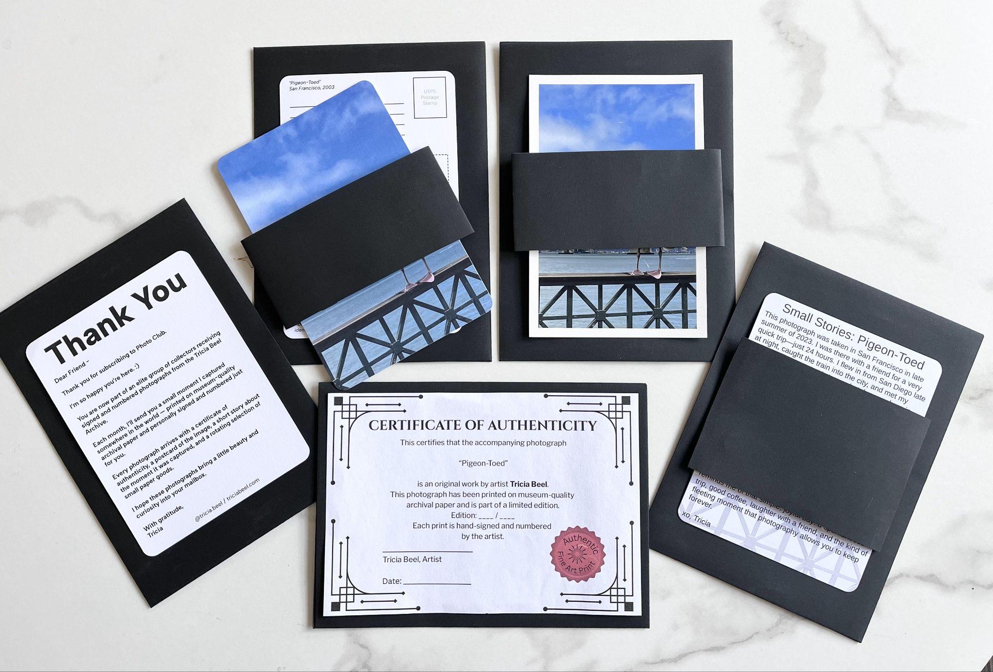 Collection of cards and envelopes with a certificate of authenticity and a thank you note