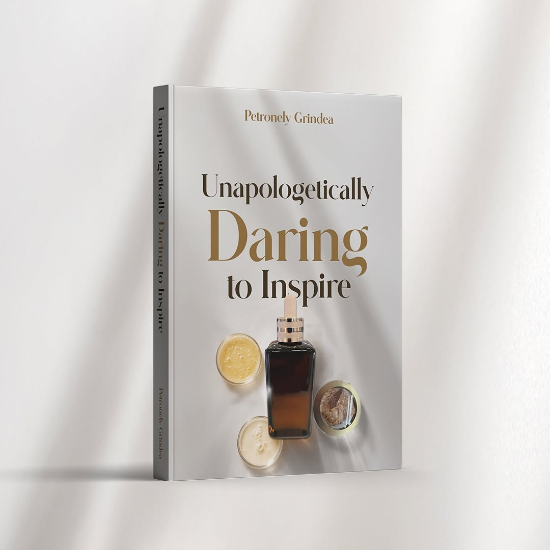 Book cover titled "Unapologetically Daring to Inspire" with a dark bottle and cream jars