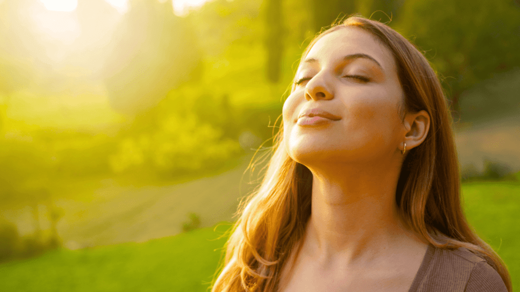 relaxed-female-in-park-looking-up-eyes-closed-1-1024x576-fda11a69.png